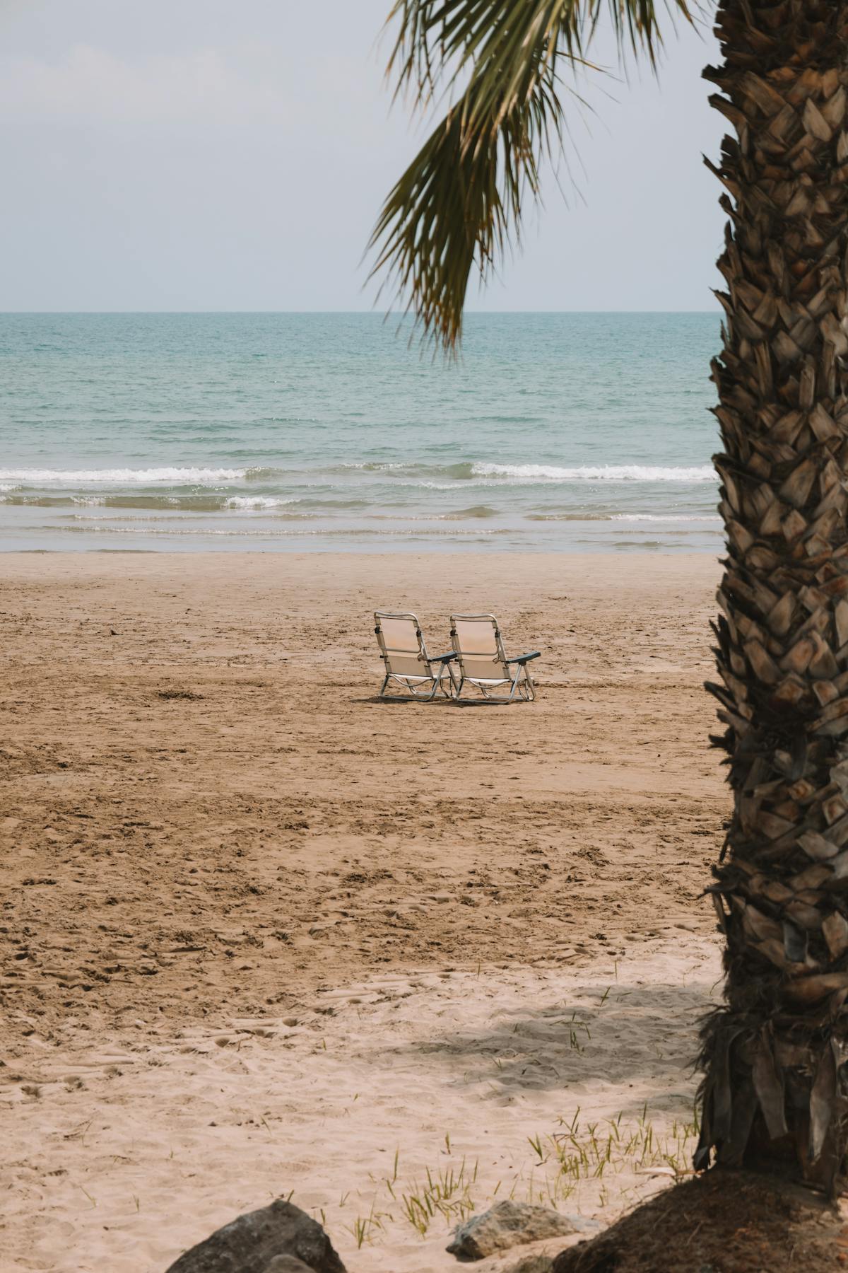 benidorm beach wit chairs