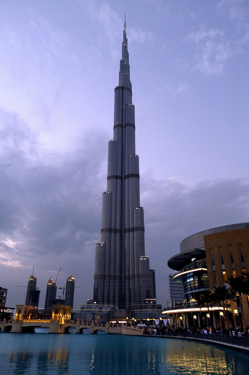Dubai like a local: view of Burj Khalifa towering over the city skyline at sunset, blending iconic landmarks with everyday life