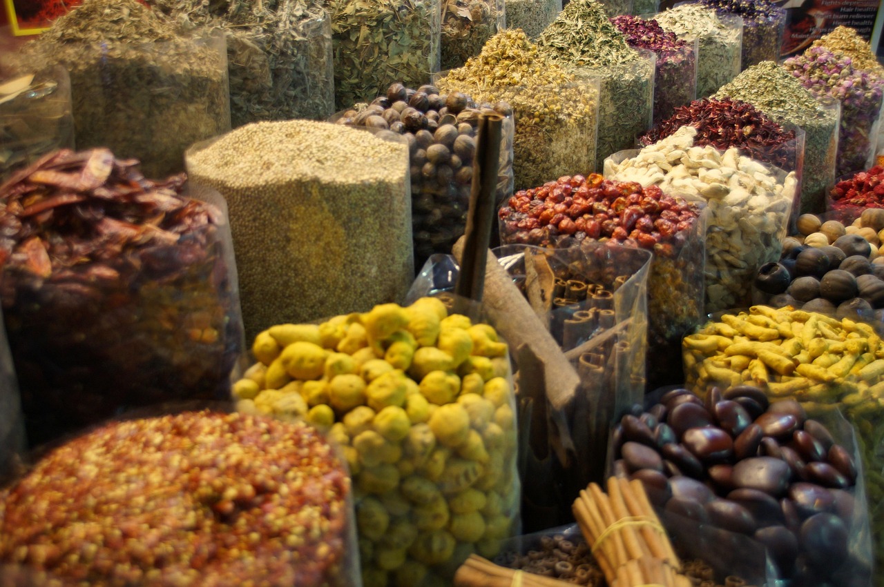 Dubai like a local: traditional souk with vibrant textiles, spices, and lanterns showcasing authentic Emirati market culture