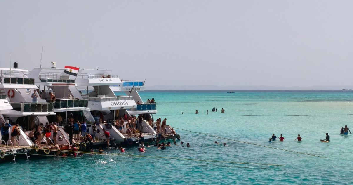 snorkeling in the crystal-clear turquoise waters of the Red Sea, Travel Easy World