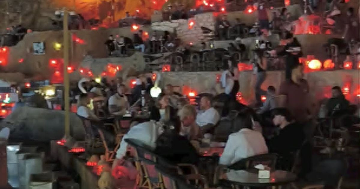 Evening atmosphere at Old Market Sharm El Sheikh with tourists relaxing in traditional cafés under glowing lantern lights in Egypt