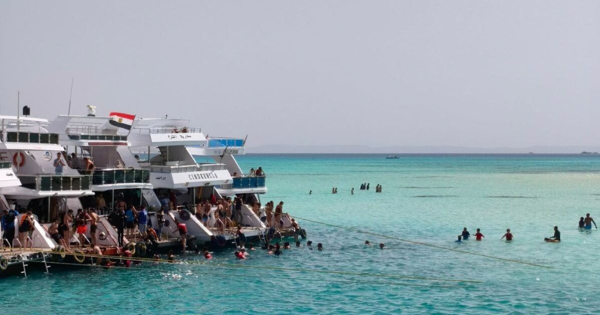 Tour boats anchored in crystal-clear water during a Ras Mohammed National Park snorkeling trip near Sharm El Sheikh, Egypt Travel Easy World